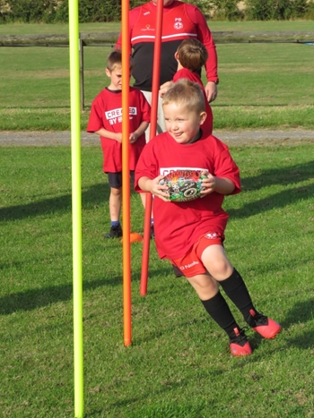 Minis practicing rugby skills