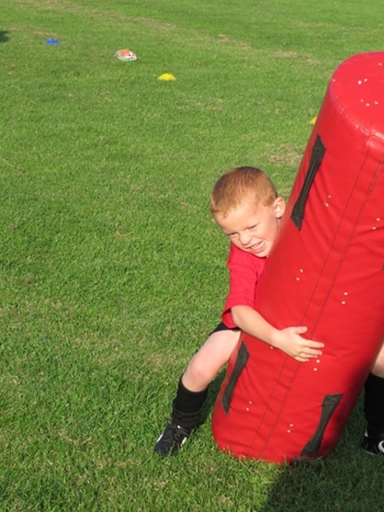 Minis practicing rugby skills