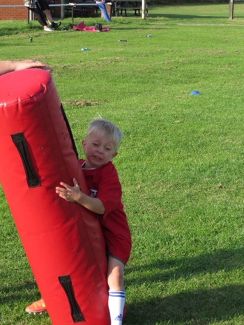 Minis practicing rugby skills